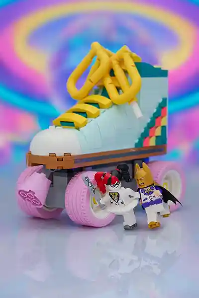 LEGO Harley Quinn in a white tutu outfit gleefully attacks Disco Batman, dressed in a purple tux and golden cowl, beside a giant roller skate with pastel pink wheels. A vibrant, psychedelic background evokes the energetic and playful tone of The LEGO Batman Movie.