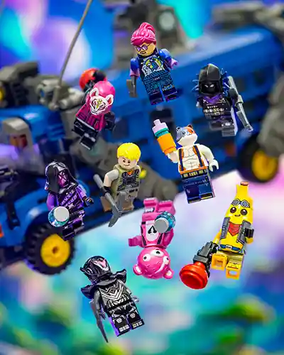 A vibrant collection of LEGO Fortnite minifigures skydiving from the Battle Bus, featuring colorful characters like Peely, Meowscles, Cuddle Team Leader, and others against a dynamic background.