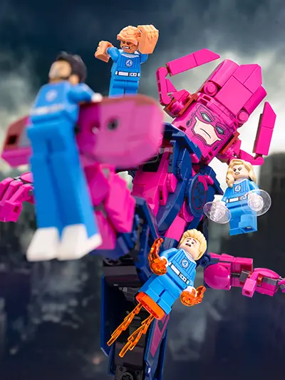 LEGO Fantastic Four minifigures launch an aerial attack on a towering Galactus build, with dramatic action poses and a stormy background setting the stage for an epic Marvel showdown.