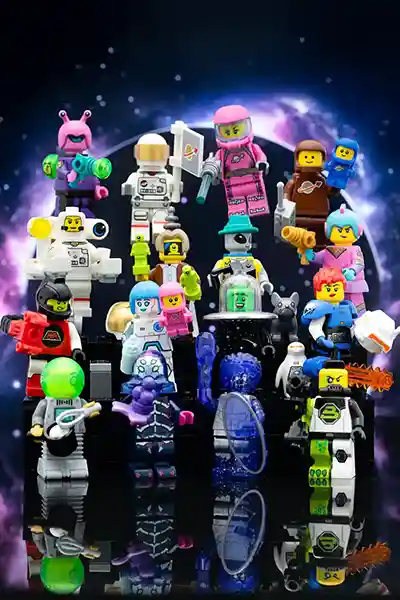 A colorful collection of LEGO space-themed minifigures from LEGO CMF Series 26, including aliens, astronauts, and robots, posed together in front of a cosmic purple-and-black portal backdrop.