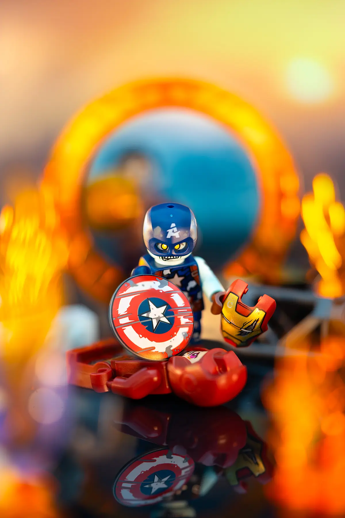 Zombie Captain America looms over Iron Man's defeated body, with his shield and helmet in hand. Enhanced lighting, deeper color contrast, and cleaner effects intensify the fiery, apocalyptic mood of the LEGO scene.