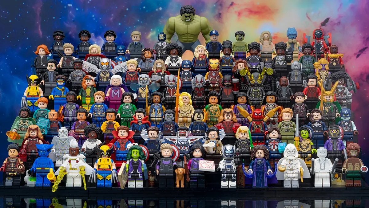 Large group photo of LEGO Marvel minifigures arranged on tiered black steps, featuring characters from across the MCU including Hulk, Spider-Man, Iron Man, Doctor Strange, and Black Panther, set against a colorful cosmic background.